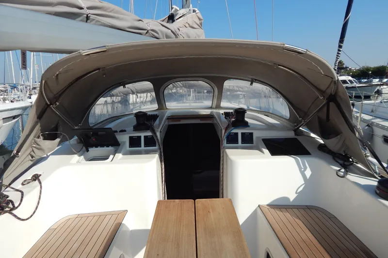  Yacht Photos Pics Italia Yachts 13.98 (2021) cockpit with canopy, showcasing modern design and wood accents.