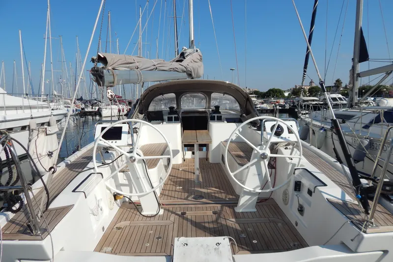  Yacht Photos Pics Italia Yachts 13.98 (2021) sailboat cockpit with dual steering wheels in marina.