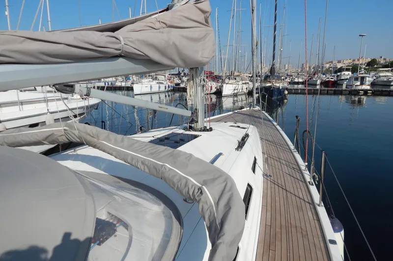  Yacht Photos Pics Italia Yachts 13.98 (2021) sailboat docked in a marina, showcasing sleek deck design.