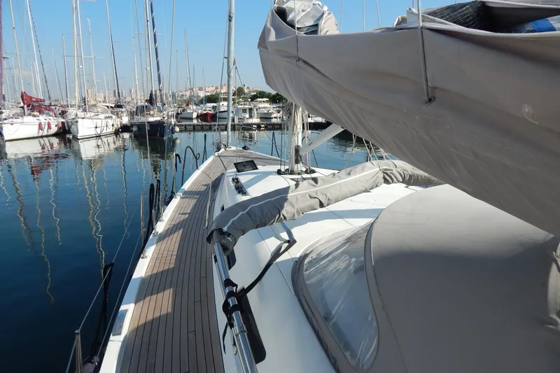  Yacht Photos Pics Italia Yachts 13.98 (2021) docked in a marina, showcasing sleek deck design.