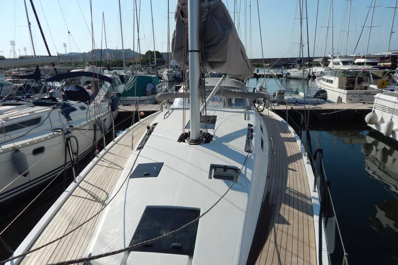  Yacht Photos Pics Italia Yachts 13.98, 2021 model, docked in a marina with other sailboats.