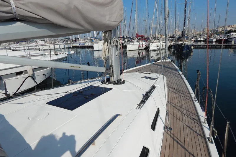  Yacht Photos Pics Italia Yachts 13.98, 2021 model, docked in a marina with other sailboats.