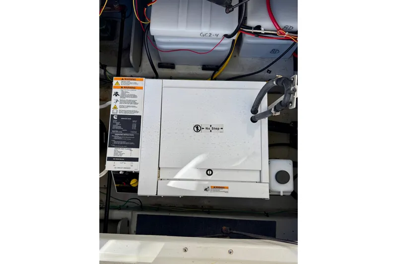 Trademarc Yacht Photos Pics Engine compartment of a 2004 Meridian 490 Pilothouse with visible wiring and components.