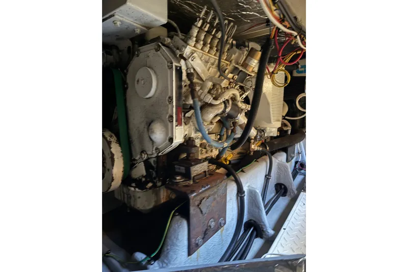 Trademarc Yacht Photos Pics Engine compartment of a 2004 Meridian 490 Pilothouse boat, showcasing mechanical components.