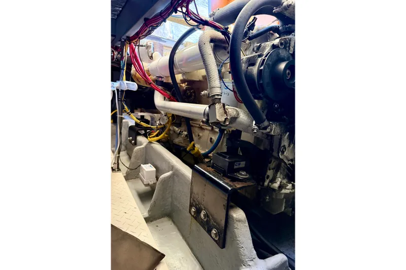 Trademarc Yacht Photos Pics Engine compartment of a 2004 Meridian 490 Pilothouse with visible wiring and components.