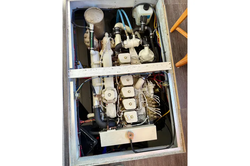 Trademarc Yacht Photos Pics Engine compartment of a 2004 Meridian 490 Pilothouse boat, showcasing mechanical components.