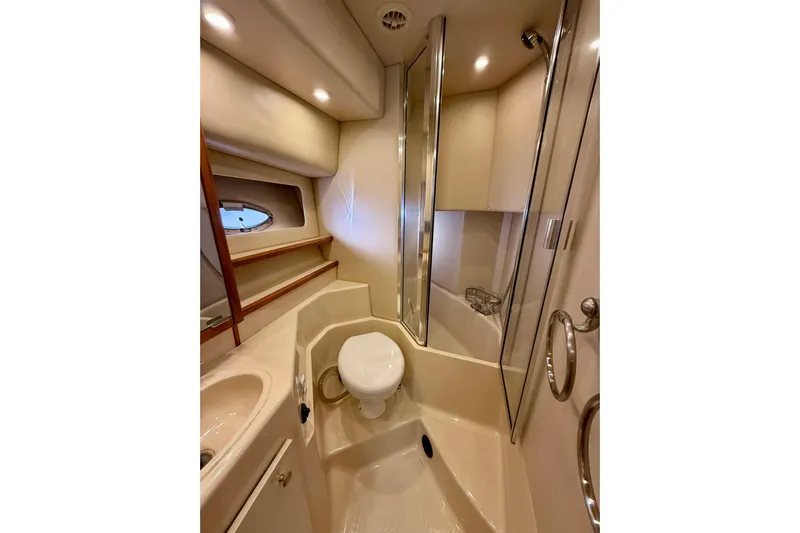 Trademarc Yacht Photos Pics 2004 Meridian 490 Pilothouse bathroom with shower, toilet, and sink.