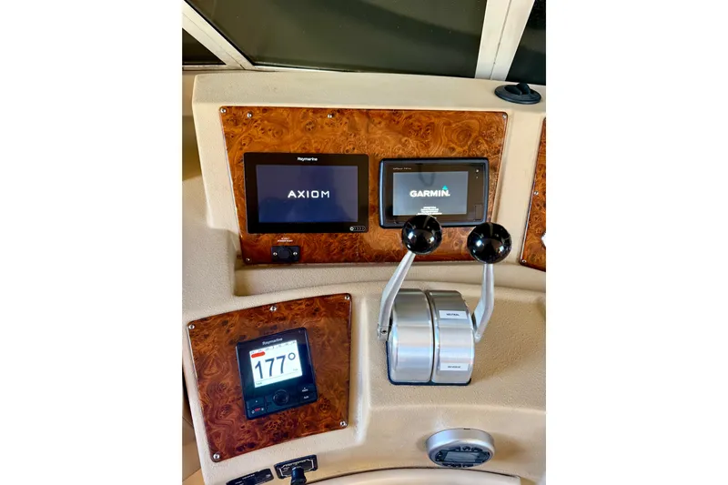 Trademarc Yacht Photos Pics 2004 Meridian 490 Pilothouse dashboard with Raymarine and Garmin navigation displays.