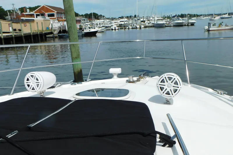  Yacht Photos Pics 2013 Sea Ray 510 Sundancer yacht bow with speakers, docked in a marina.