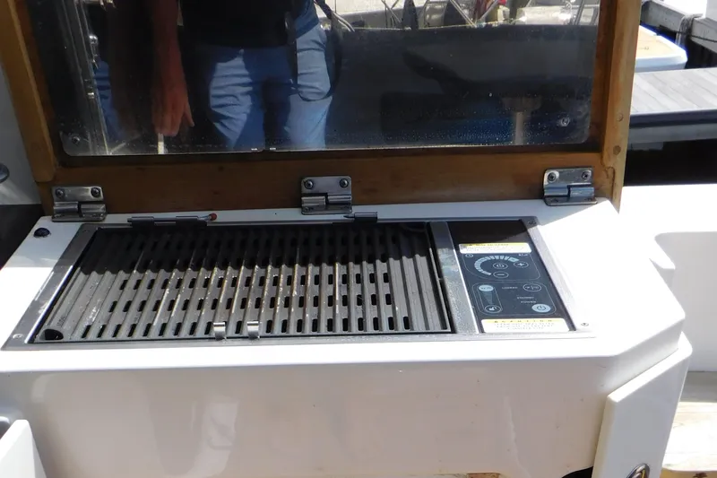  Yacht Photos Pics Outdoor grill on 2013 Sea Ray 510 Sundancer yacht, featuring control panel and protective cover.