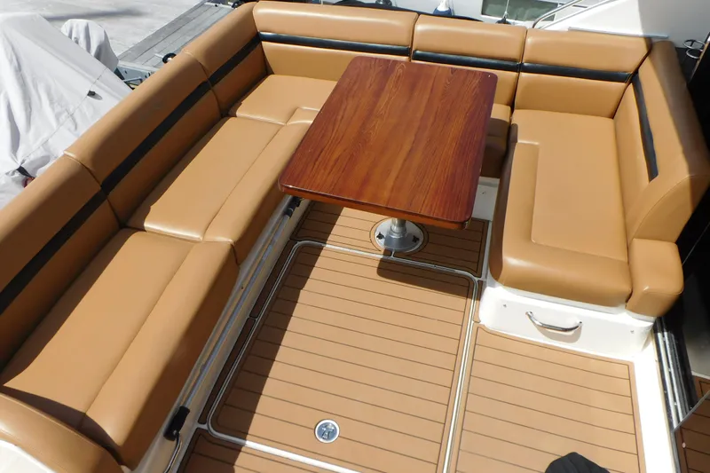  Yacht Photos Pics Luxurious seating area on 2013 Sea Ray 510 Sundancer yacht with wooden table.