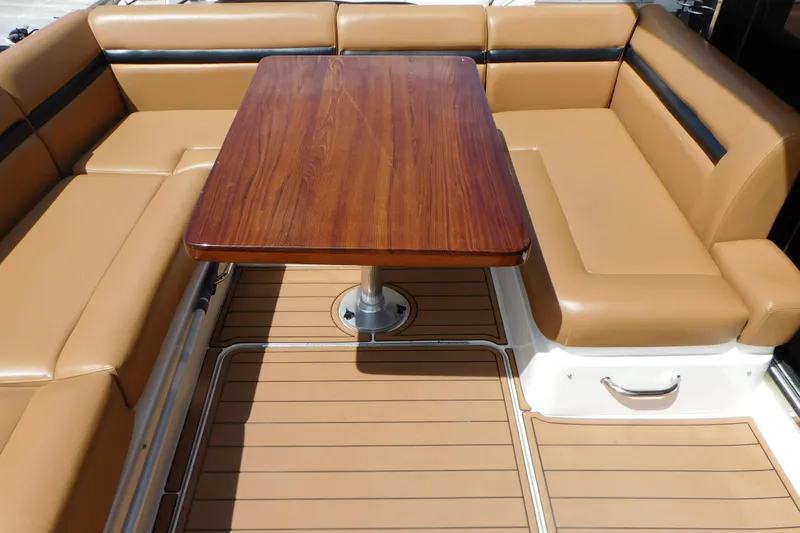  Yacht Photos Pics Luxurious seating area on 2013 Sea Ray 510 Sundancer yacht with wooden table.