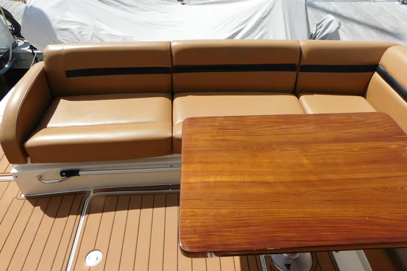 Yacht Photos Pics Luxurious seating and wooden table on 2013 Sea Ray 510 Sundancer yacht.