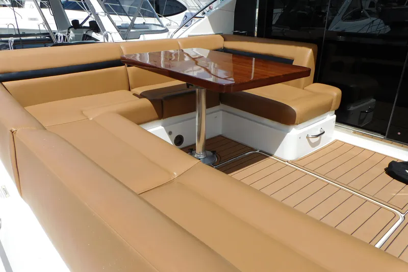  Yacht Photos Pics Luxurious seating area on 2013 Sea Ray 510 Sundancer yacht with wooden table.