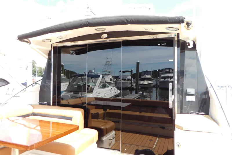  Yacht Photos Pics 2013 Sea Ray 510 Sundancer yacht with sleek glass doors and luxurious seating area.