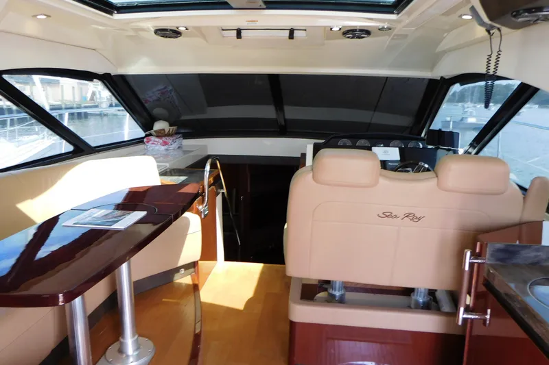  Yacht Photos Pics Interior of 2013 Sea Ray 510 Sundancer yacht with luxurious seating and helm.