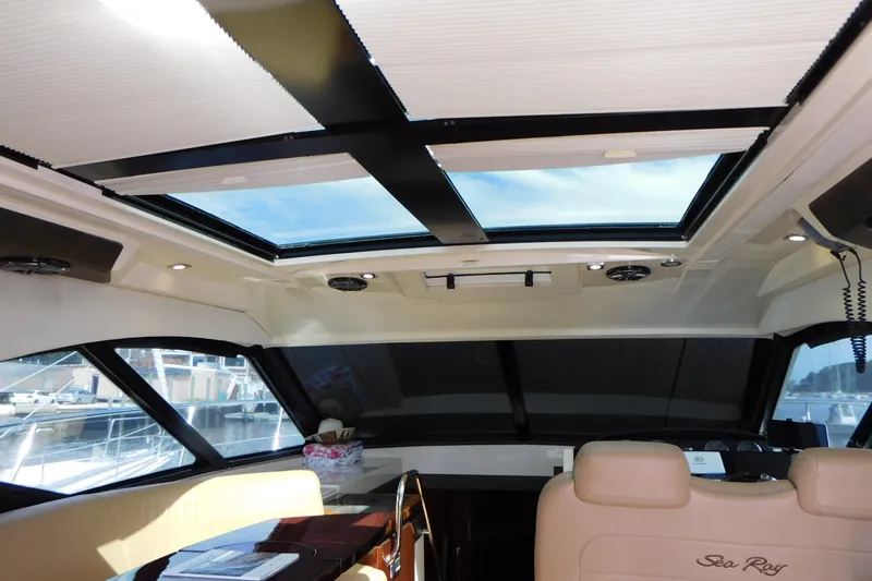  Yacht Photos Pics Interior view of 2013 Sea Ray 510 Sundancer yacht with sunroof and luxurious seating.