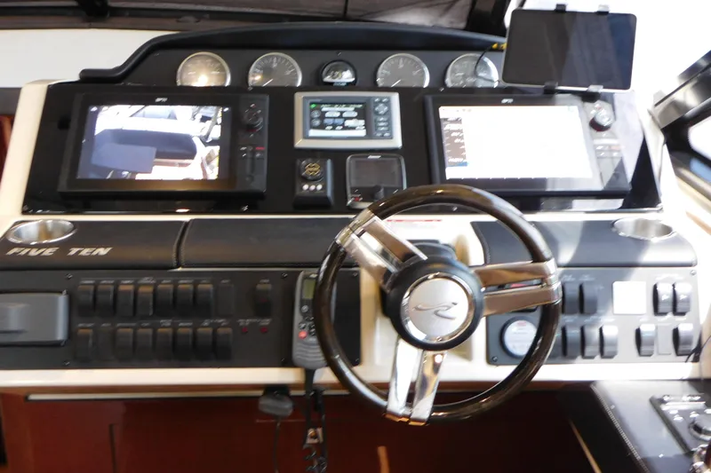  Yacht Photos Pics 2013 Sea Ray 510 Sundancer helm with advanced navigation displays and controls.