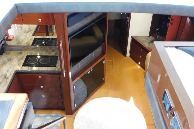  Yacht Photos Pics Luxurious interior of 2013 Sea Ray 510 Sundancer yacht with modern kitchen and cozy living space.