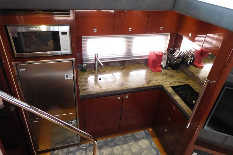  Yacht Photos Pics Luxurious kitchen interior of 2013 Sea Ray 510 Sundancer yacht with modern appliances.