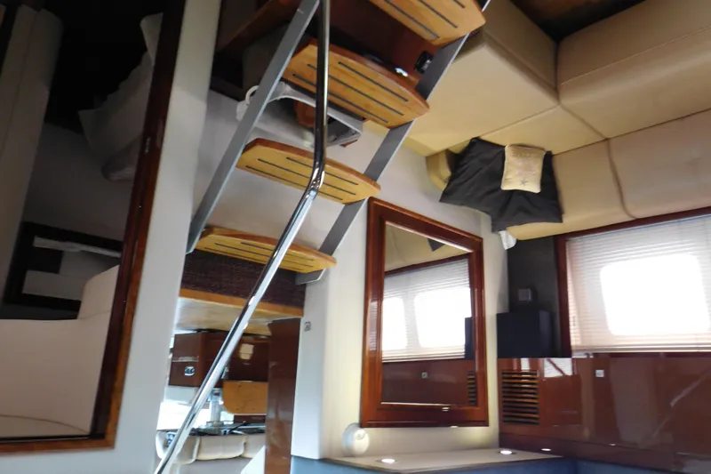  Yacht Photos Pics Interior of 2013 Sea Ray 510 Sundancer yacht with modern furnishings and wooden accents.
