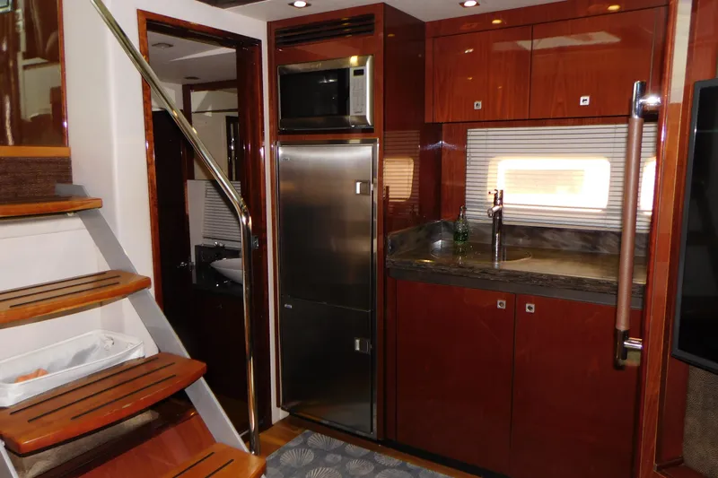  Yacht Photos Pics Luxurious 2013 Sea Ray 510 Sundancer yacht interior with modern kitchen and wooden stairs.