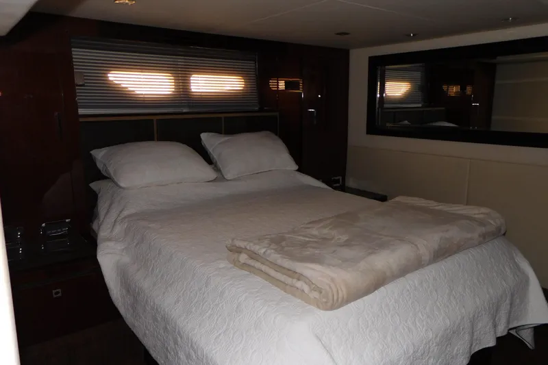  Yacht Photos Pics Luxurious bedroom interior of 2013 Sea Ray 510 Sundancer yacht with cozy bedding.