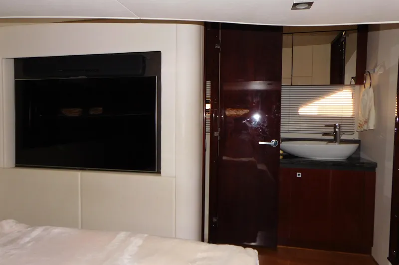  Yacht Photos Pics Luxurious interior of 2013 Sea Ray 510 Sundancer yacht with modern bathroom and TV.