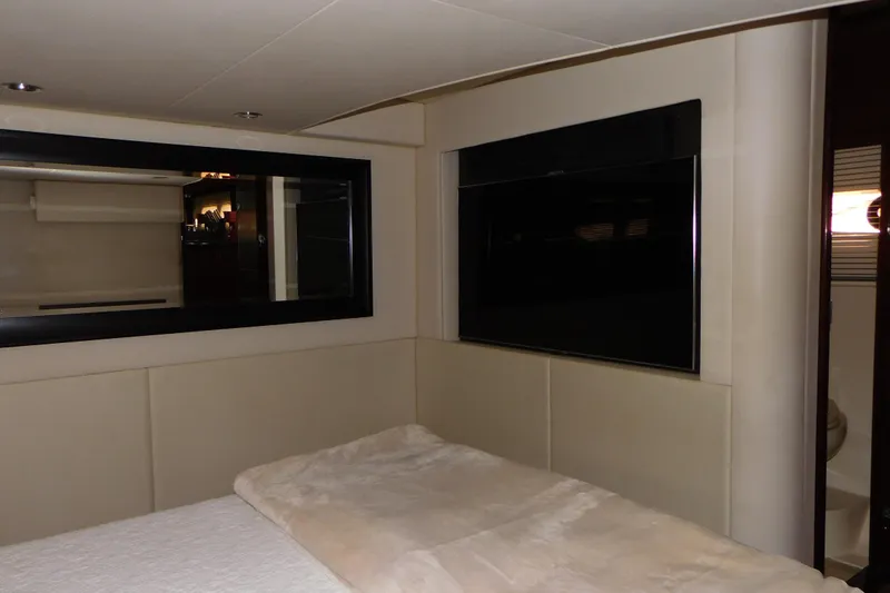  Yacht Photos Pics Luxurious interior of 2013 Sea Ray 510 Sundancer yacht bedroom with modern decor.