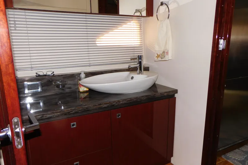  Yacht Photos Pics Luxurious bathroom in 2013 Sea Ray 510 Sundancer yacht with modern sink and elegant finishes.