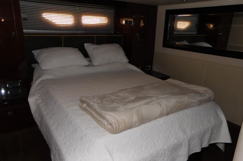 Yacht Photos Pics Luxurious bedroom interior of 2013 Sea Ray 510 Sundancer yacht with cozy bedding.