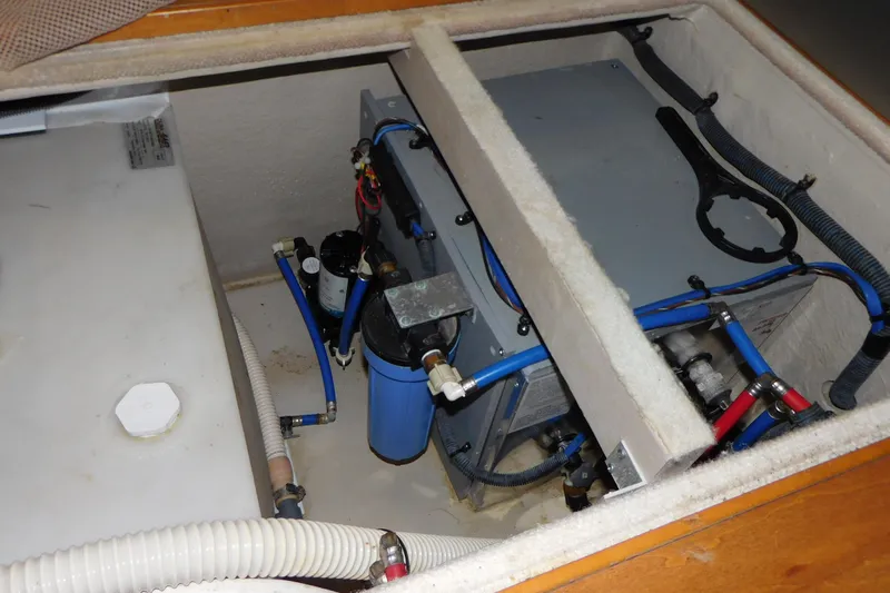  Yacht Photos Pics Engine compartment of 2013 Sea Ray 510 Sundancer with visible water filtration system.