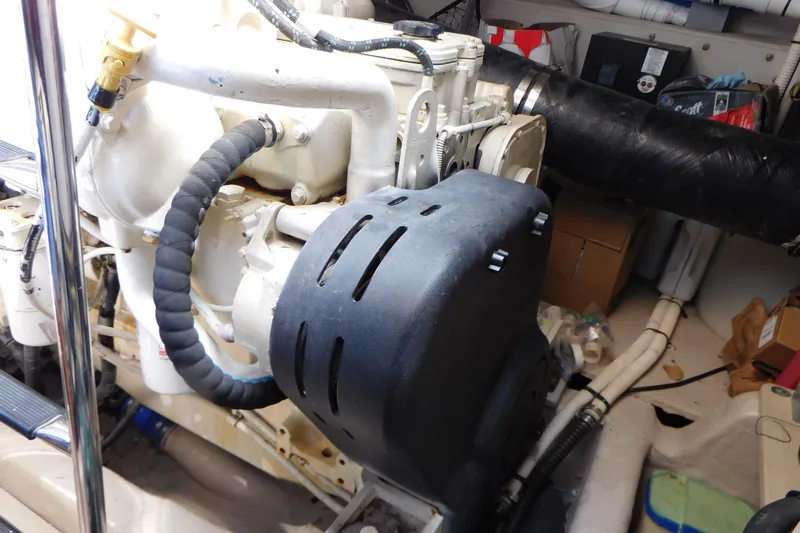  Yacht Photos Pics Engine compartment of a 2013 Sea Ray 510 Sundancer boat, showcasing mechanical components.