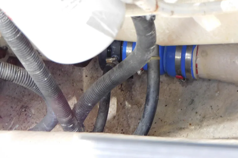  Yacht Photos Pics Engine compartment of 2013 Sea Ray 510 Sundancer with hoses and clamps visible.