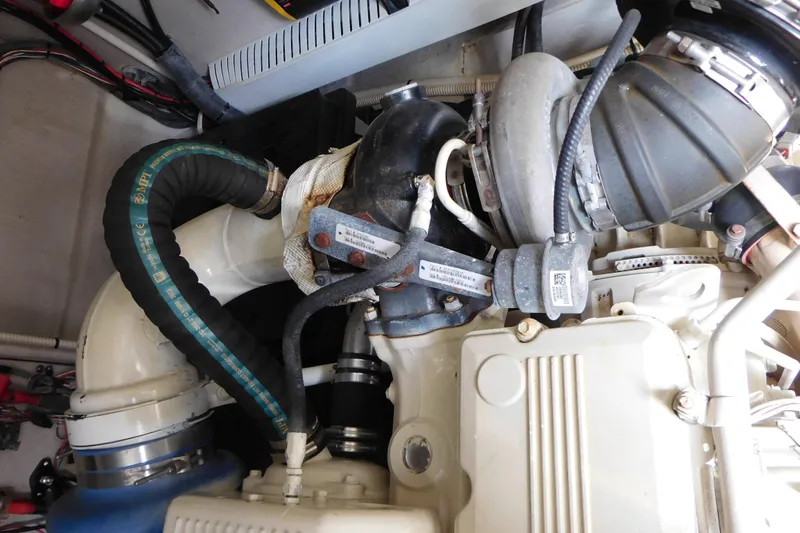  Yacht Photos Pics Engine compartment of a 2013 Sea Ray 510 Sundancer boat, showcasing mechanical components.