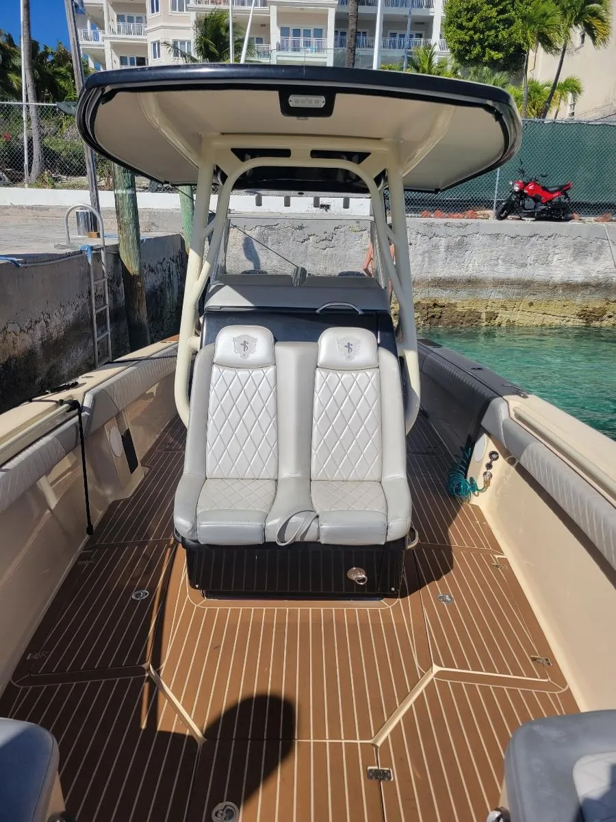 2013 Statement 38 SUV Open boat with dual seats and teak flooring.