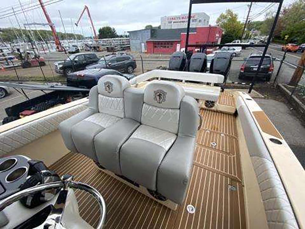 2013 Statement 38 SUV Open boat interior with luxury seating and wooden deck.