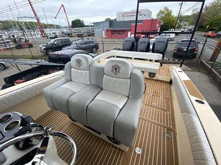  Yacht Photos Pics 2013 Statement 38 SUV Open boat interior with luxury seating and wooden deck.