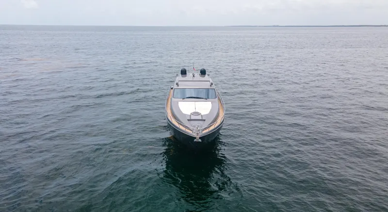 Wind Yacht Photos Pics 2009 Pershing 64 yacht on open water, viewed from the front.