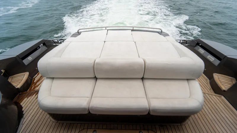 Wind Yacht Photos Pics Luxury sunbed on 2009 Pershing 64 yacht, cruising through ocean waters.