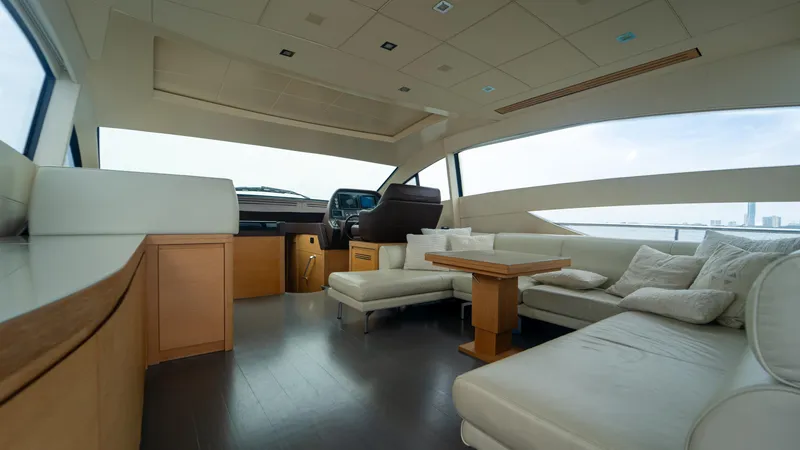 Wind Yacht Photos Pics Luxurious interior of a 2009 Pershing 64 yacht with modern seating and helm.