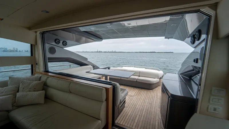 Wind Yacht Photos Pics Luxurious interior view of a 2009 Pershing 64 yacht overlooking the ocean.