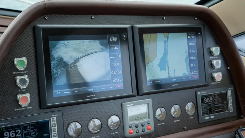 Wind Yacht Photos Pics Control panel of a 2009 Pershing 64 yacht with navigation screens and gauges.