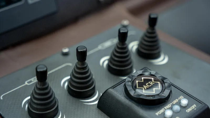 Wind Yacht Photos Pics Control panel of a 2009 Pershing 64 yacht with joystick controls and ACR button.