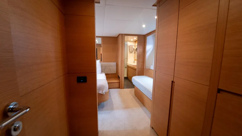Wind Yacht Photos Pics Luxurious interior of a 2009 Pershing 64 yacht, featuring wood paneling and modern design.