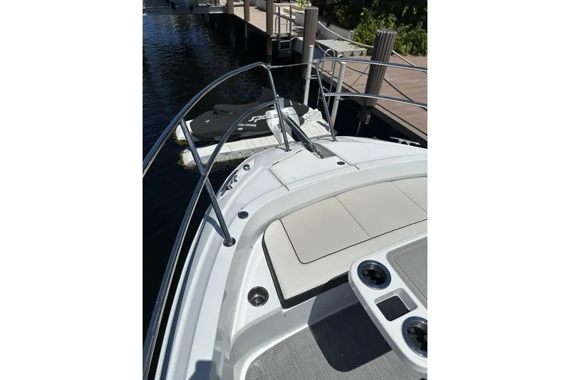  Yacht Photos Pics 2022 Jeanneau Leader 12.5 WA boat deck with seating and railing, docked by water.
