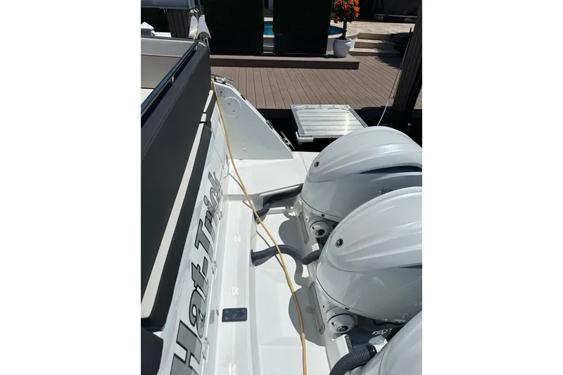  Yacht Photos Pics 2022 Jeanneau Leader 12.5 WA boat with dual outboard engines, docked on a sunny day.