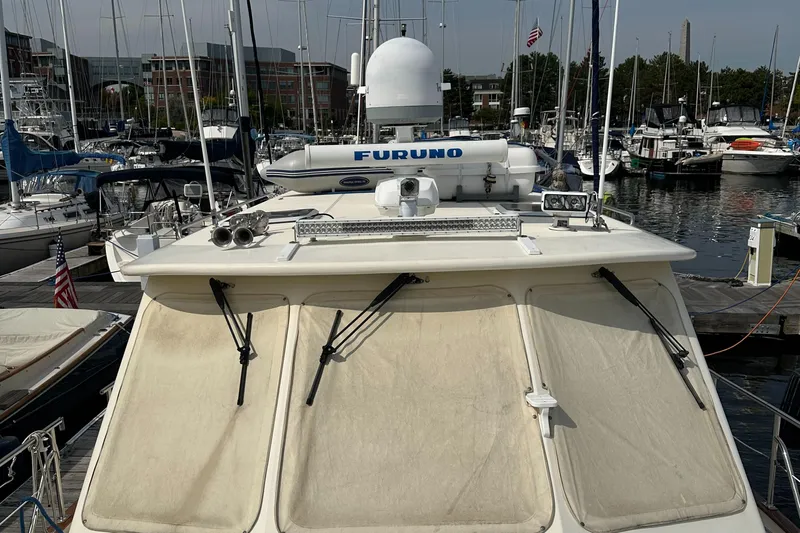 Blue Sora Yacht Photos Pics Legacy 42 yacht, 2005 model, docked in a marina with radar equipment visible.