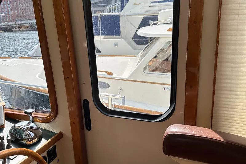 Blue Sora Yacht Photos Pics Interior view of 2005 Legacy 42 yacht with marina backdrop.