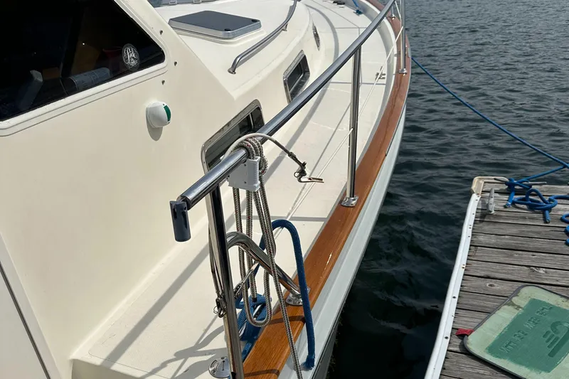 Blue Sora Yacht Photos Pics Legacy 42 yacht from 2005 docked, featuring sleek design and polished railings.